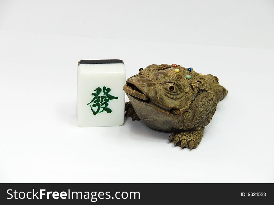 Money frog and mahjong on the white background