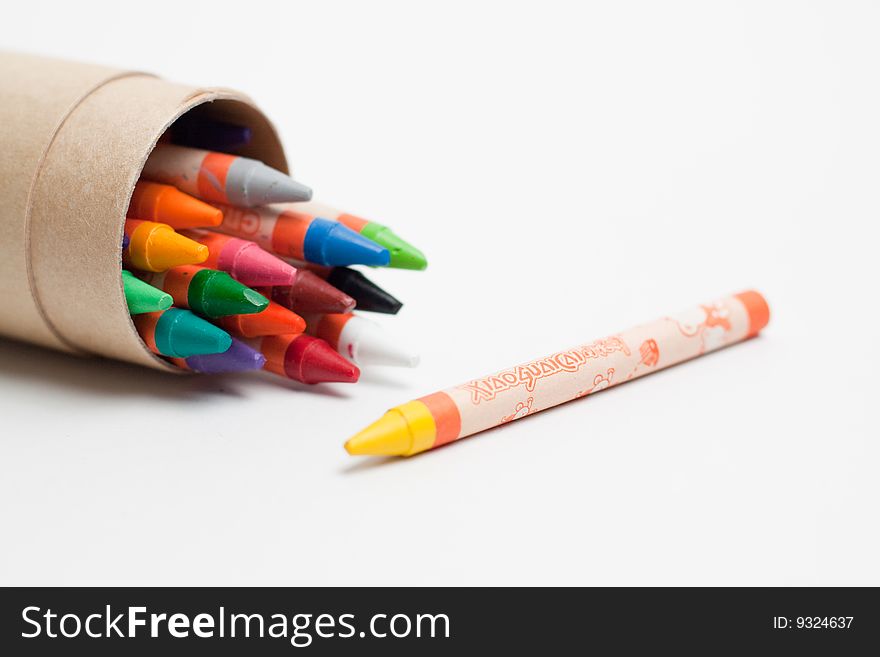 Various colors of wax crayons inside tube case. Various colors of wax crayons inside tube case