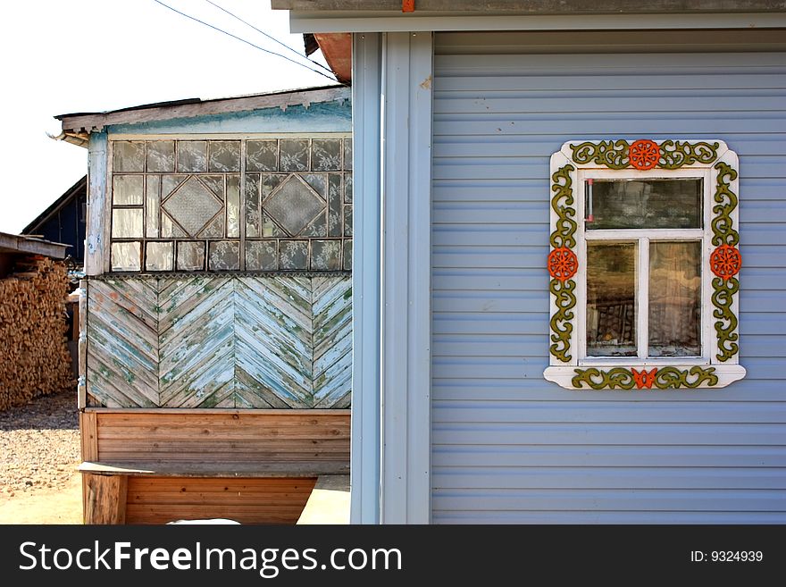 Old-style Russian wooden village house or izba in the countryside. Old-style Russian wooden village house or izba in the countryside