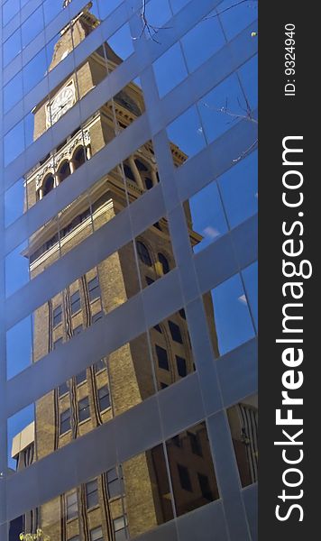 A reflection of the historic May D&F clock tower which stands on the 16th street mall in downtown Denver, Colorado. A reflection of the historic May D&F clock tower which stands on the 16th street mall in downtown Denver, Colorado.