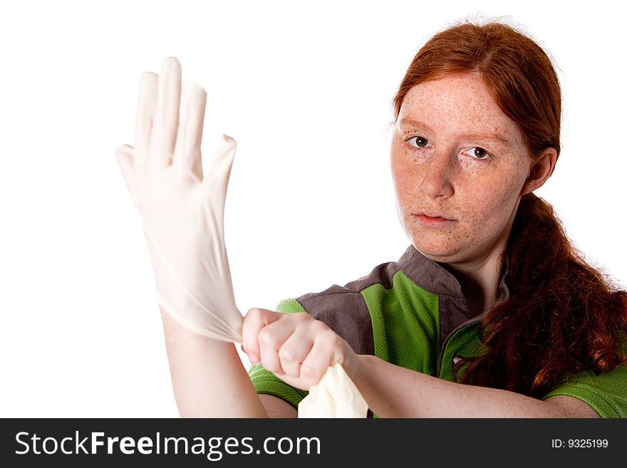 Studio shot of health caretaker putting on her gloves. Studio shot of health caretaker putting on her gloves.