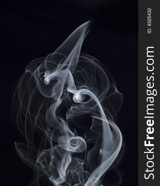 Puff of smoke abstract on the black background
