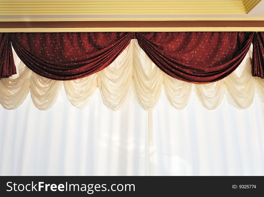Dark red rippled textile curtain