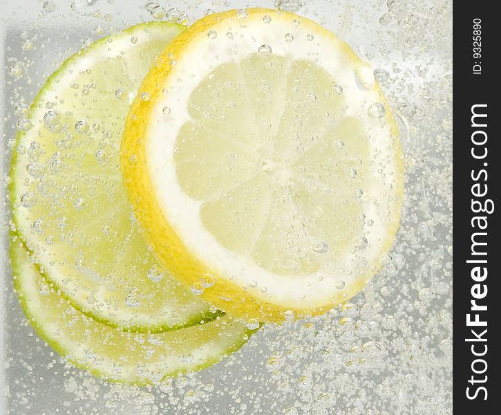 Lemon and lime in fizzy water