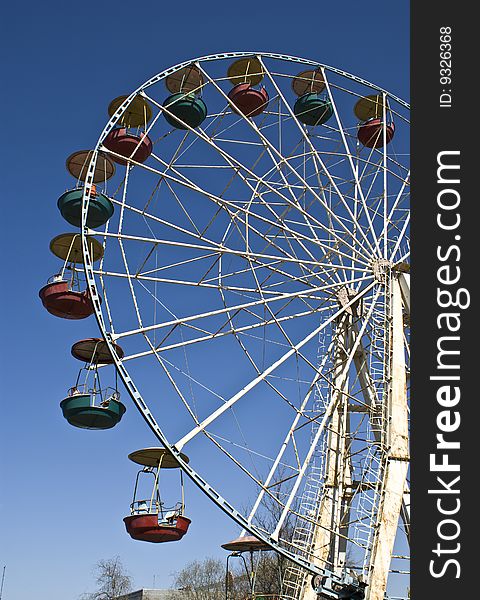 Big wheel on a background of the blue sky