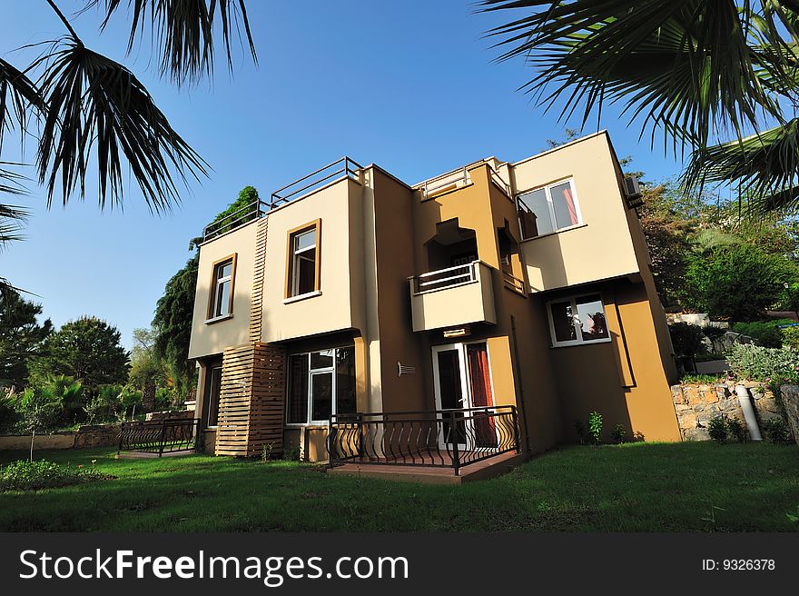 New cottage in tropical garden wide angle lens