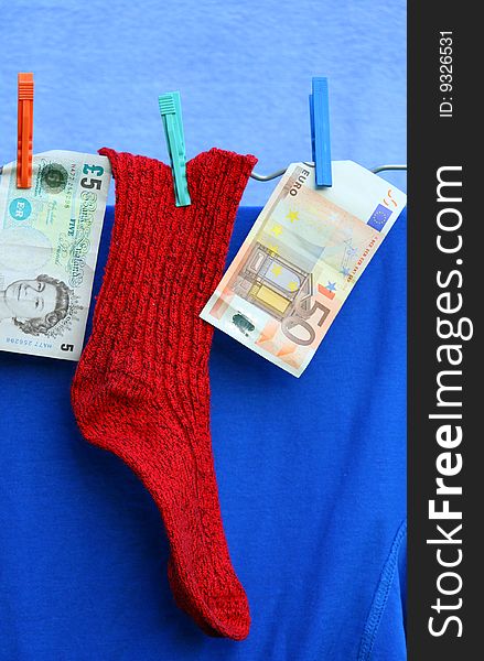 Red sock and two banknotes. Red sock and two banknotes