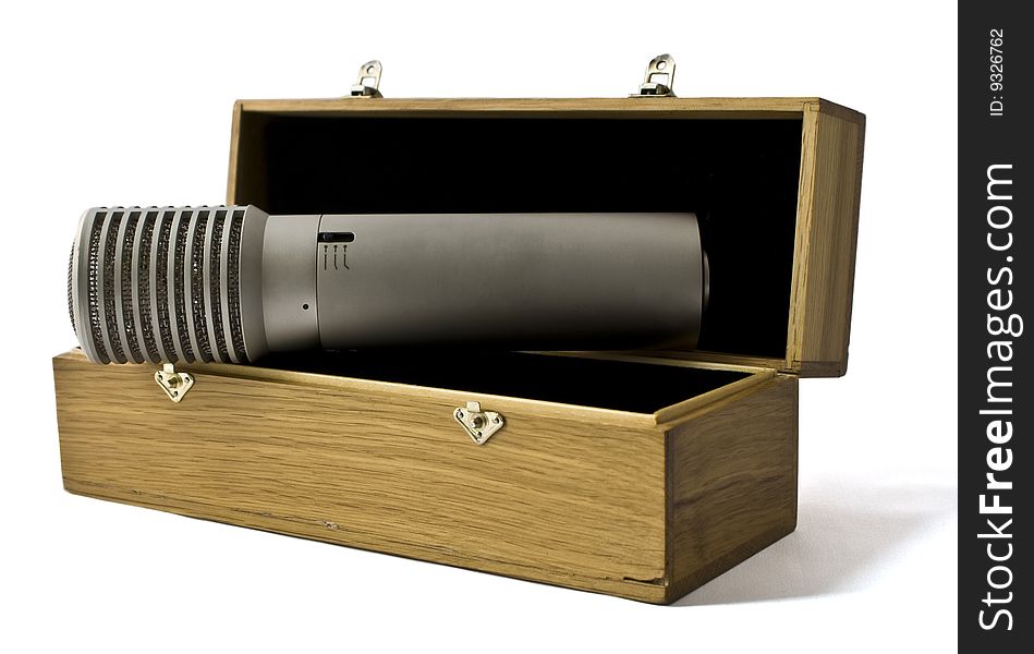 Studio microphone in a wooden case on a white background