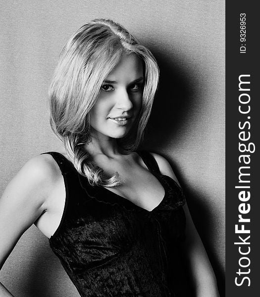 Black and white portrait of blonde in black dres