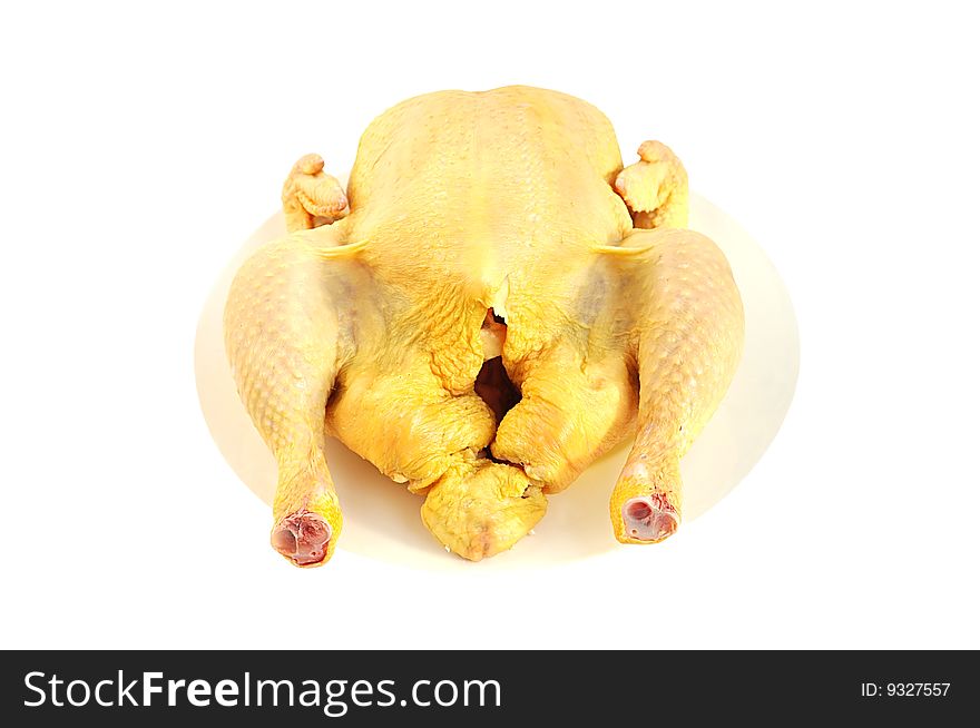 Raw chicken on the plate isolated over white with clipping path. Raw chicken on the plate isolated over white with clipping path.