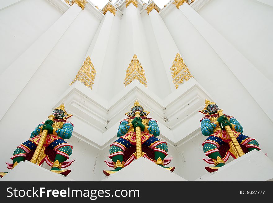 Giant statues around pagoda of Wat Pitchayatikaram, Bangkok, Thailand. Giant statues around pagoda of Wat Pitchayatikaram, Bangkok, Thailand