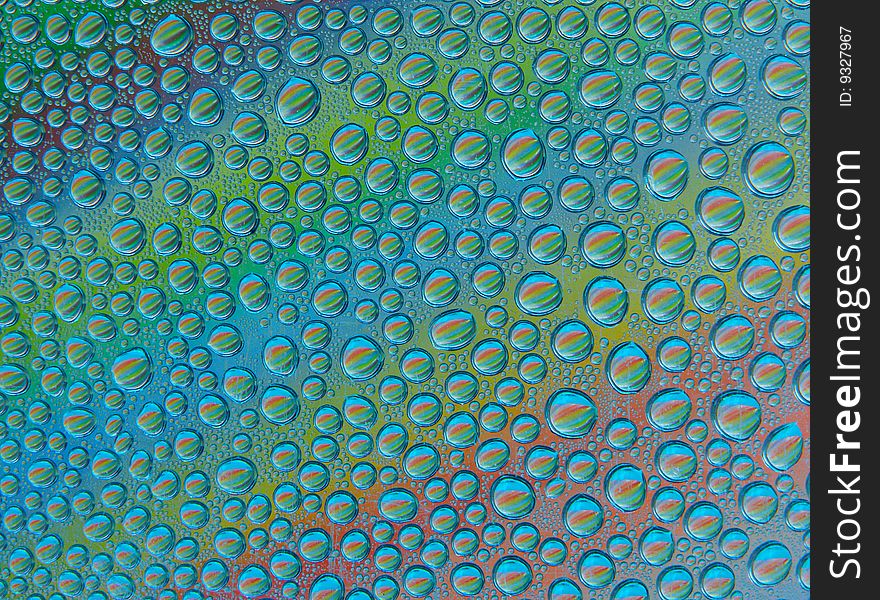 Colorful rainbow water drops background. Colorful rainbow water drops background