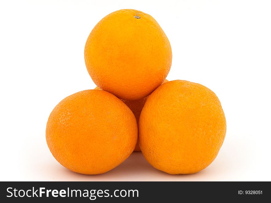 Orange fruits pyramid on the background. Orange fruits pyramid on the background