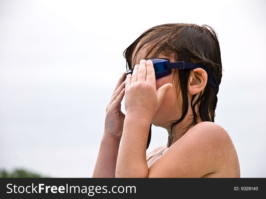 Girl Putting On Goggles