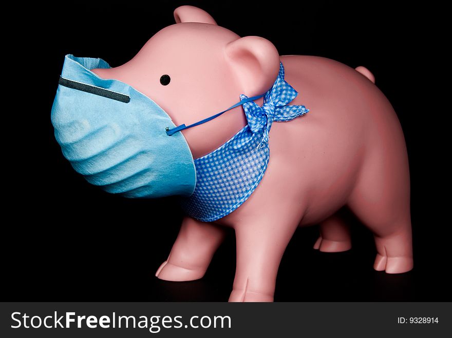 Piggy bank wearing a surgical mask. Piggy bank wearing a surgical mask.