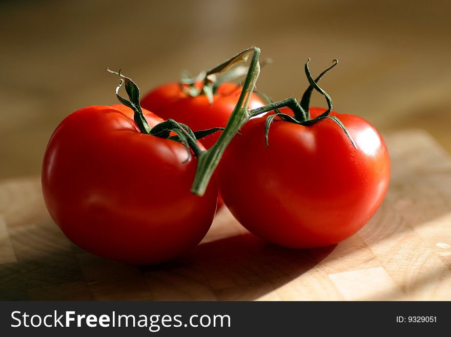 Red Tomato with brown background