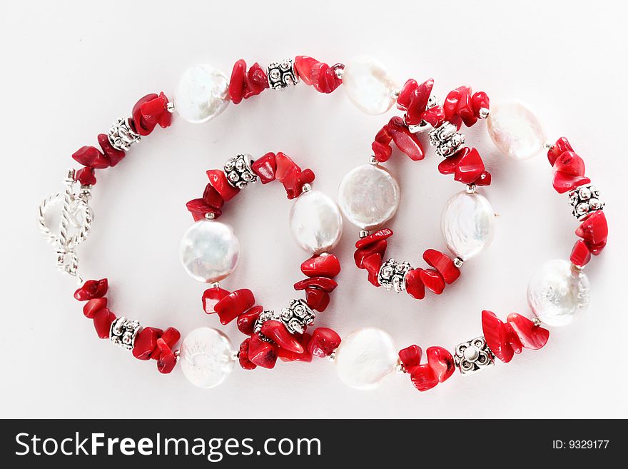 Red necklace with pearls isolated. Red necklace with pearls isolated