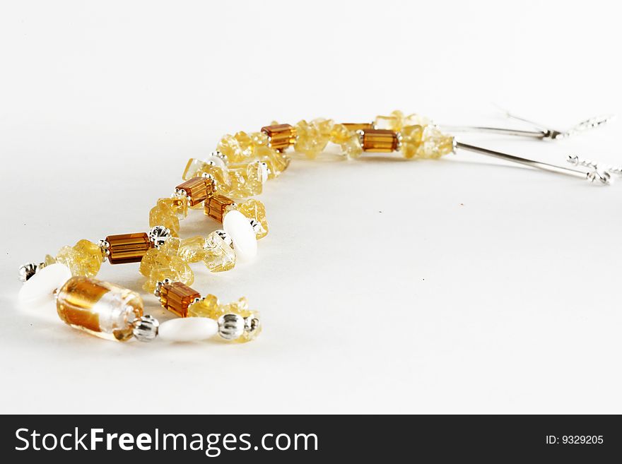 Yellow necklace with silver isolated