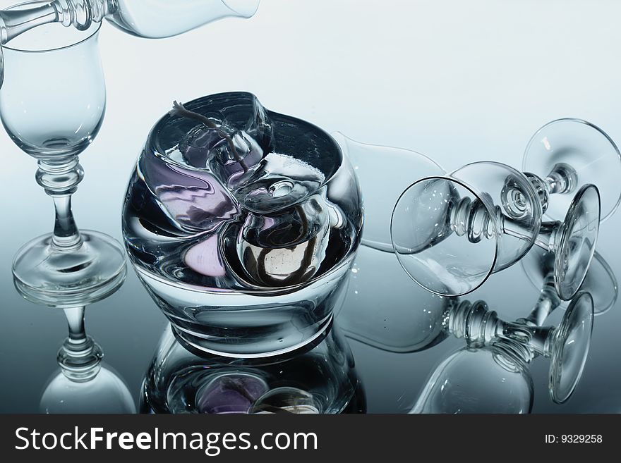 Wine glasses and abstract glass over mirror. Wine glasses and abstract glass over mirror