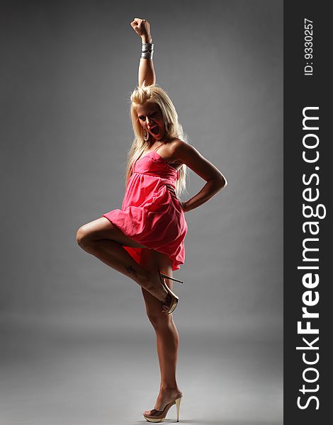 Modern style dancer posing on studio background. Modern style dancer posing on studio background