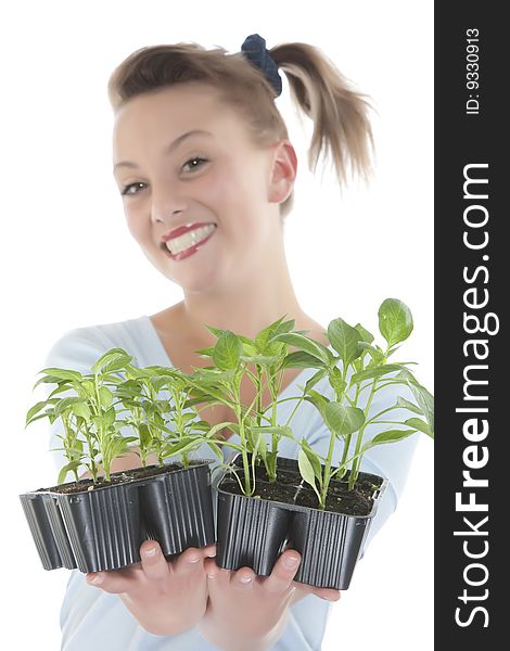 Smiling Girl Holding Young Plants