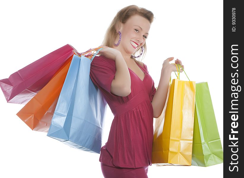 Portrait of an attractive young woman holding several shoppingbags.