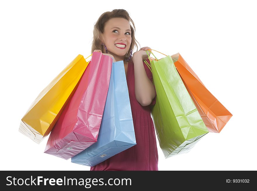 Portrait of an attractive young woman holding several shoppingbags.