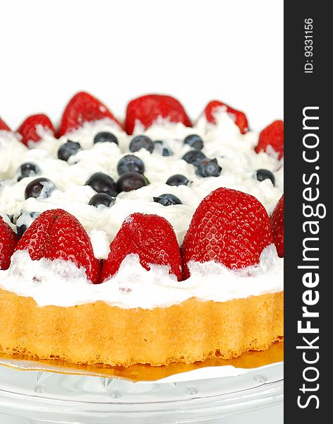 Strawberry, blueberry and heavy whipped cream cake isolated on the white. Strawberry, blueberry and heavy whipped cream cake isolated on the white.