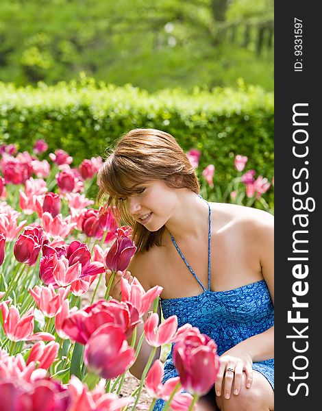 College Girl Smelling the Pretty Pink Tulips