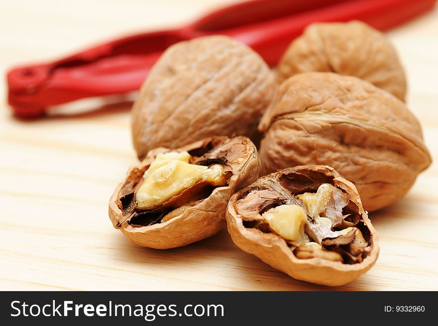Walnuts with red walnut cracker