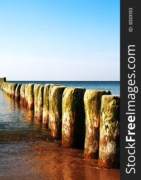 wooden pegs in the sea - sea - beach. wooden pegs in the sea - sea - beach