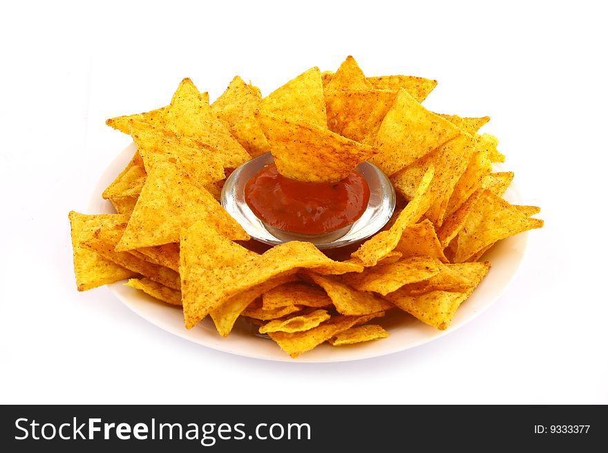 Salsa dip in a bowl on brown background