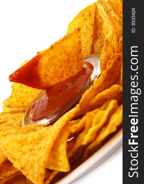 Salsa dip in a bowl on brown background