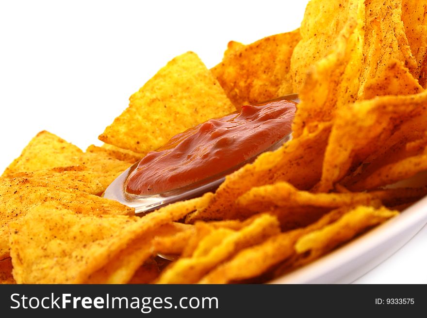 Salsa dip in a bowl on brown background