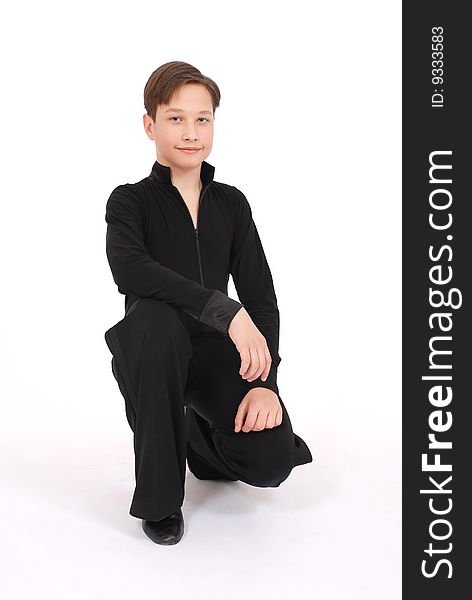 Boy In Black Costume Posing In Studio