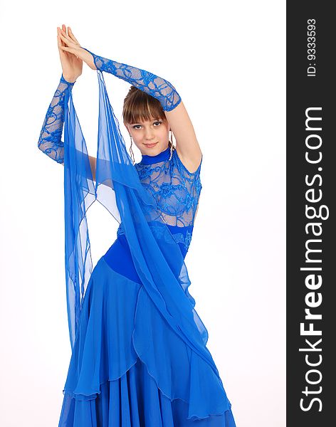 Girl in blue dress posing in studio on white background