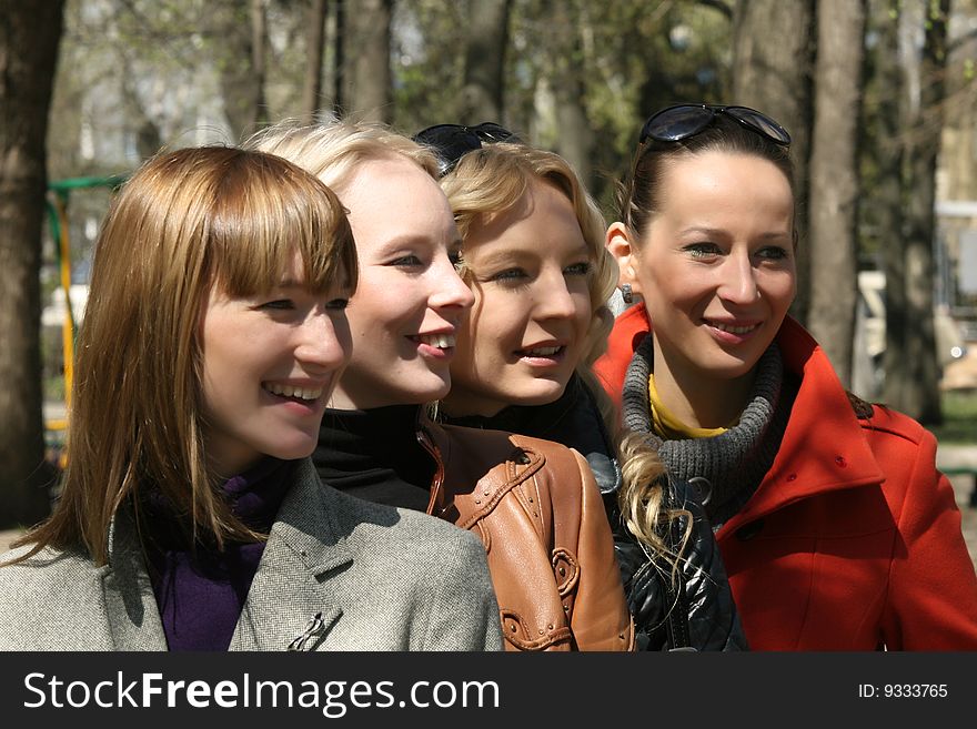 Four female friends in a park. Four female friends in a park