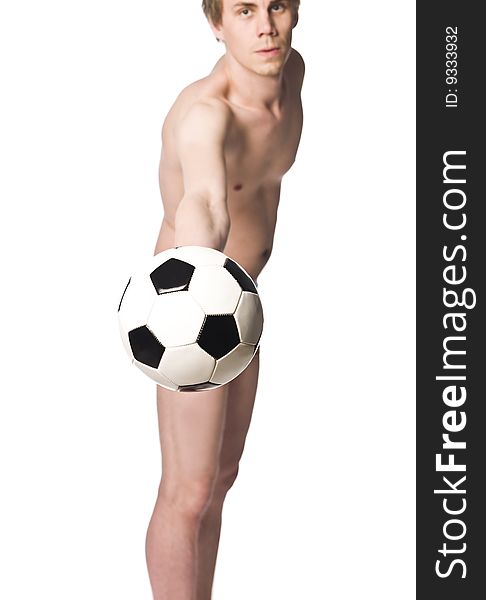 Man using a football to hide he is nude. Man using a football to hide he is nude