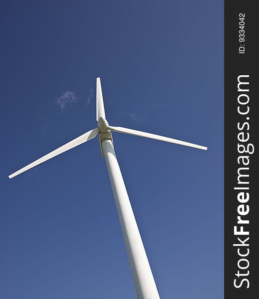 Wind power station towards blue sky