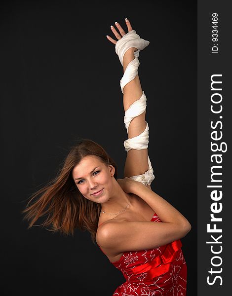 Portrait of elegant young flexible woman in red-white outfit