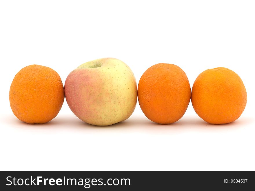 Apple and oranges on the white background