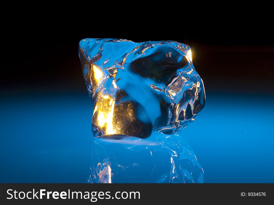 Chunk of ice bottom lit by a blue light. Chunk of ice bottom lit by a blue light