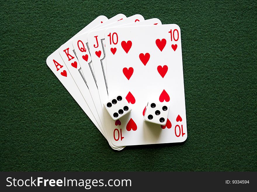 Five cards  - royal flush ont the green table