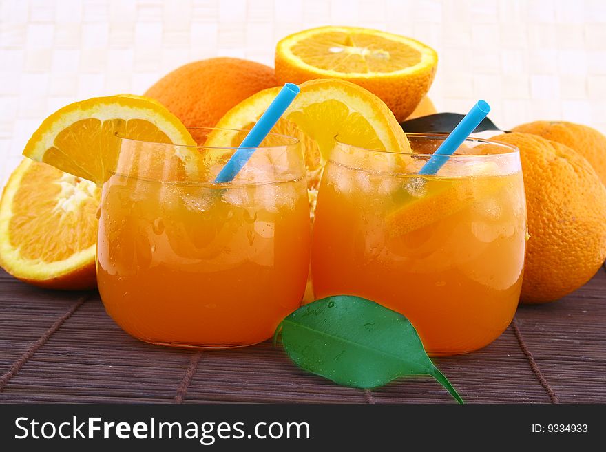 Orange and orange juice in a glass. Orange and orange juice in a glass