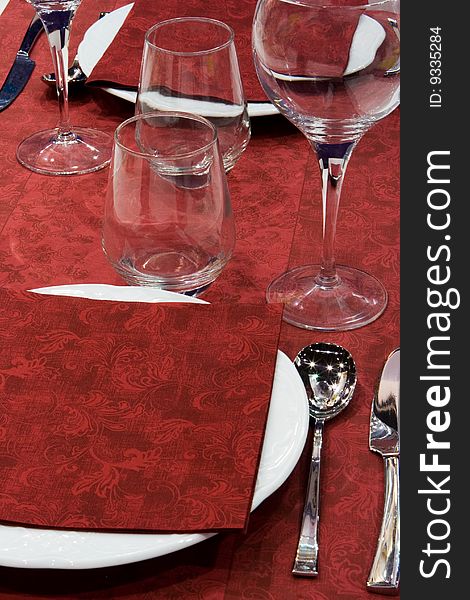 Red Elegant Table Setting with Drinking Glasses. Red Elegant Table Setting with Drinking Glasses