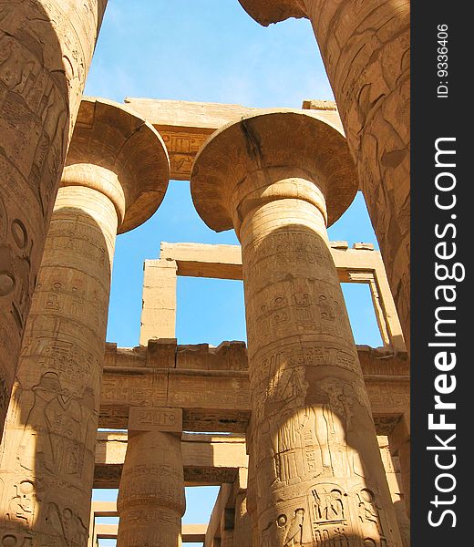 Grandiose colonnade of hypostile hall in the Temple of Amun-Ra at Karnak. Antique Thebes. Luxor, Egypt. Grandiose colonnade of hypostile hall in the Temple of Amun-Ra at Karnak. Antique Thebes. Luxor, Egypt.