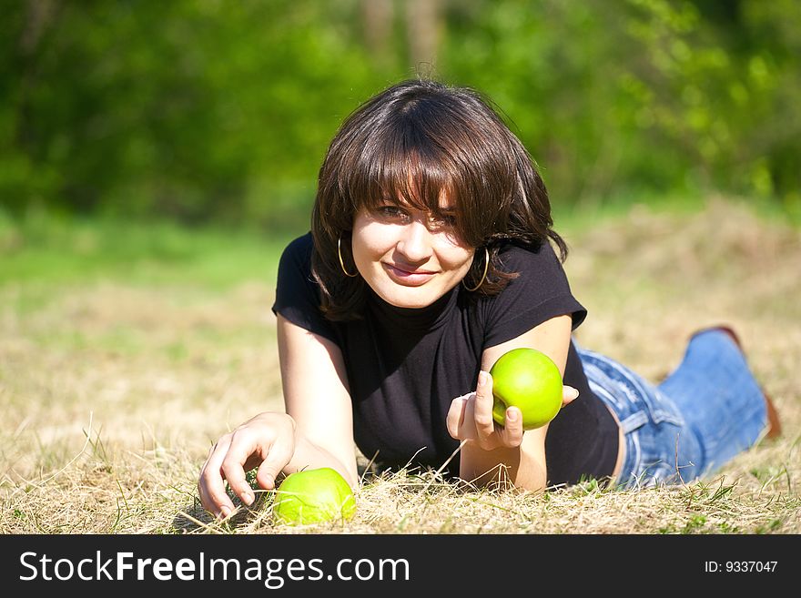 Fine girl with an apple in its left hand