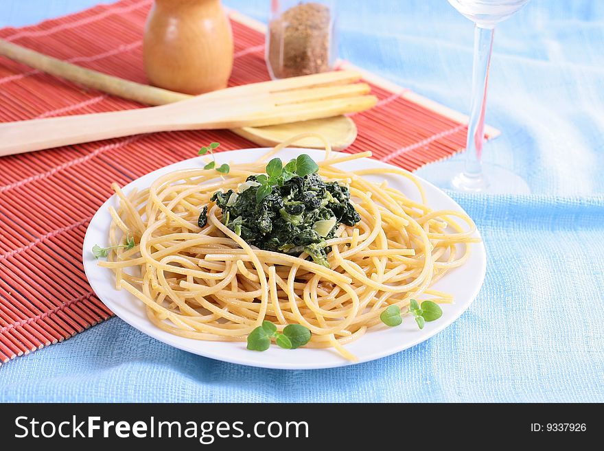 Green spinach with black olives