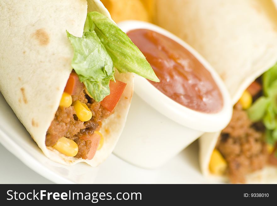 Delicious fajitas beef lettuce tomato pepper corn isolated