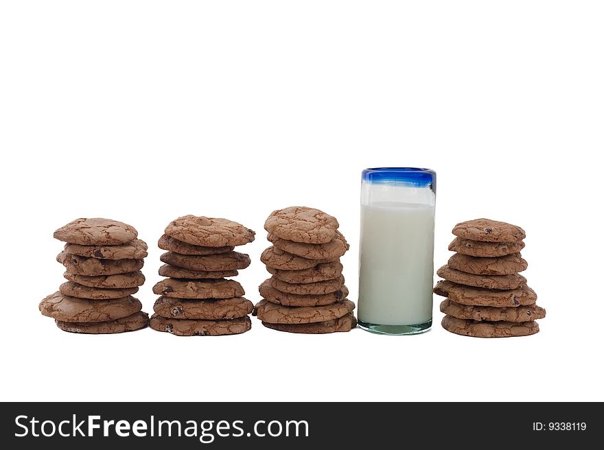 Cookies arrange in a row, with a glass of milk. Cookies arrange in a row, with a glass of milk.